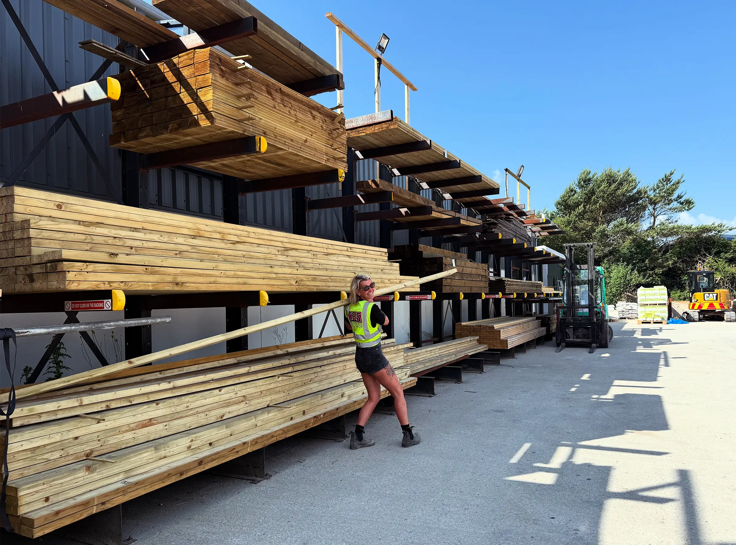A CBS employee grabbing some timber.